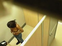 Ebony chick caught topless in the changing room