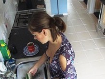 Beauty exposed in down blouse video while doing the dishes
