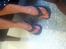 Candid Mature Feet Red Painted Toes in Flip Flops