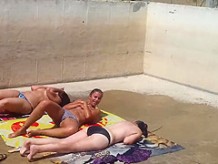 Three caught topless sunbathing