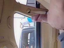 Guy strokes dick in car