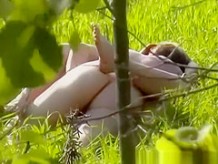 Couple naked in the field having sex