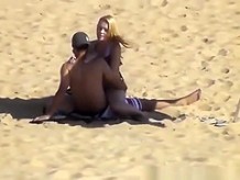 Blonde girl rides her boyfriend???s dick in beach