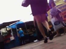 Black hair woman in a blue shirt underskirt voyeur video