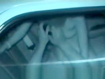Couple having sex into a car