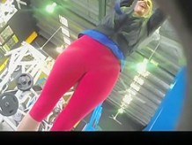 Sporty girl in red spandex pants